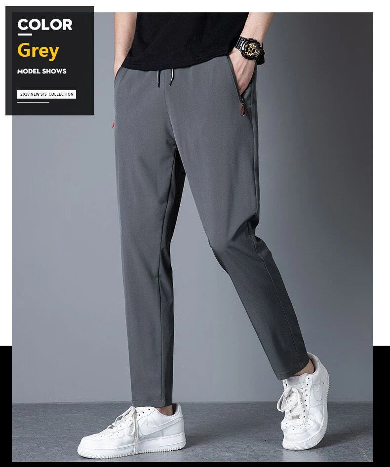 Men's casual pants straight leg slim fit elastic waist jogging pants Korean classic blue black gray men's pants plus size 4XL5XL